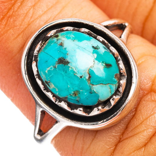 Turquoise cabochon sterling silver ring with oval stone in ornate bezel