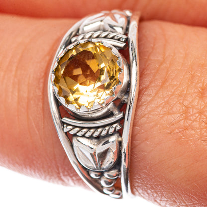 Sterling silver ring with faceted round citrine center stone in ornate bezel