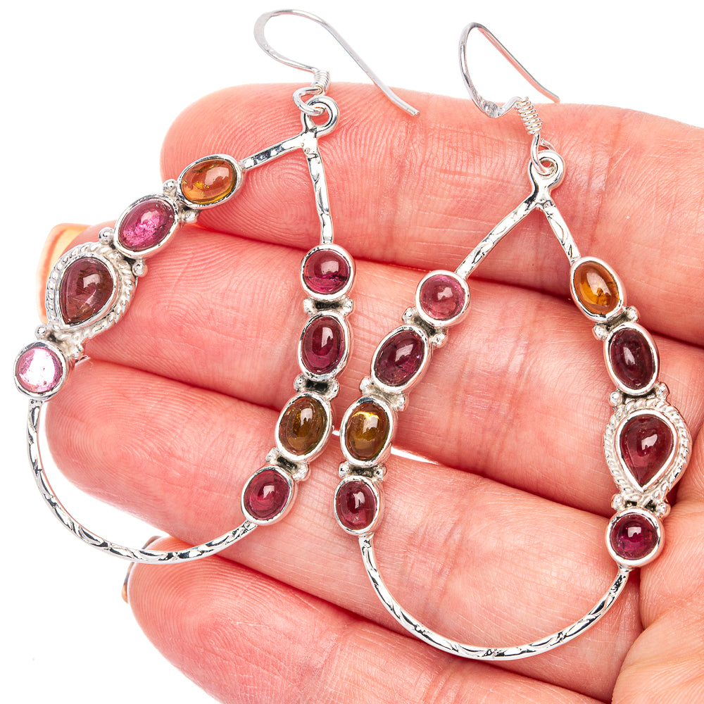 Sterling silver hoop earrings with oval pink and amber tourmaline accents