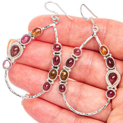Sterling silver hoop earrings with oval pink and amber tourmaline accents