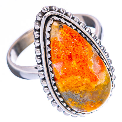Sterling silver ring with beaded border and orange-yellow teardrop speckled cabochon