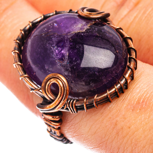 Oxidized copper wire wrap ring with oval amethyst-purple gemstone, ring size 7.5.