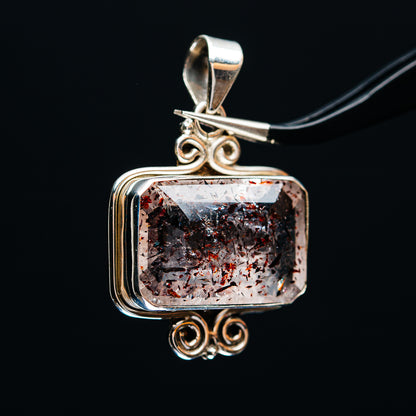 Sterling silver framed lepidocrocite pendant, ornate top bail and faceted rectangular gemstone