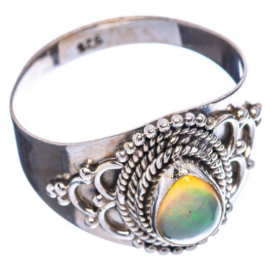 Sterling silver oval opal ring with ornate rope bezel on band, size 6.5