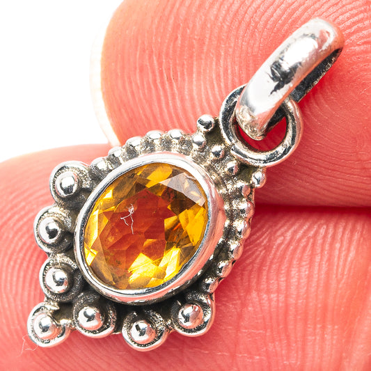 Citrine pendant in .925 sterling silver with oval amber gemstone and scalloped halo.