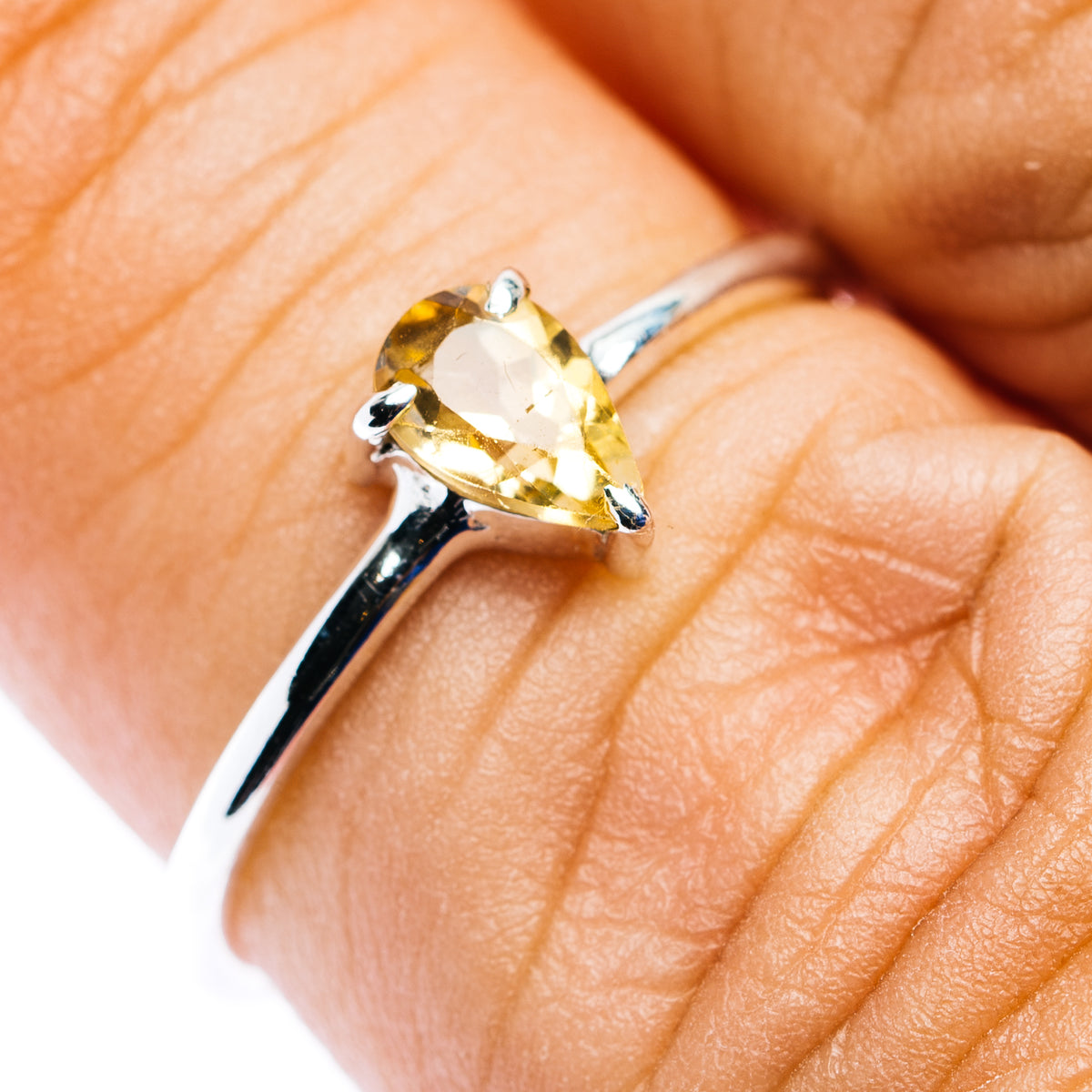 Sterling silver ring with oval citrine-yellow gemstone and prong setting