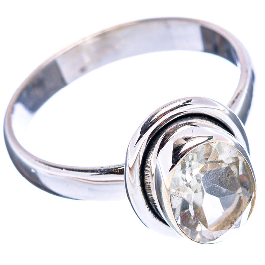 Sterling silver ring with faceted light gemstone, polished oval bezel band