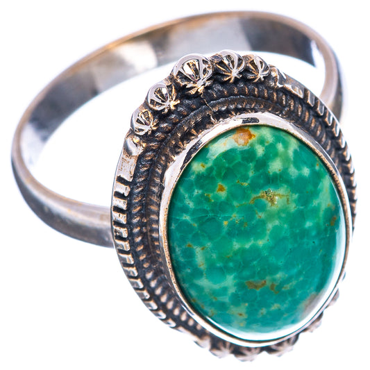 Sterling silver ring with oval green turquoise stone and etched band, star accents