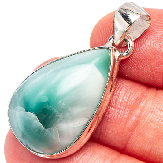 Sterling silver pendant with turquoise teardrop cabochon and silver bail