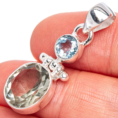 Sterling silver pendant with oval green amethyst and round blue topaz accent