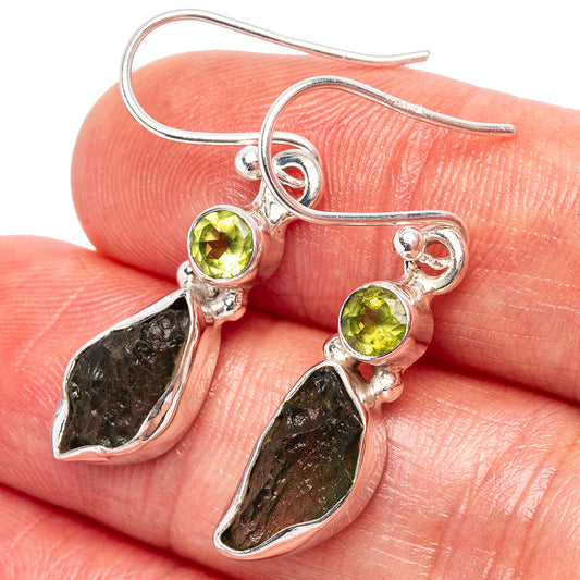 Rare moldavite earrings close-up: .925 silver hooks, green round tops, dark teardrop stones