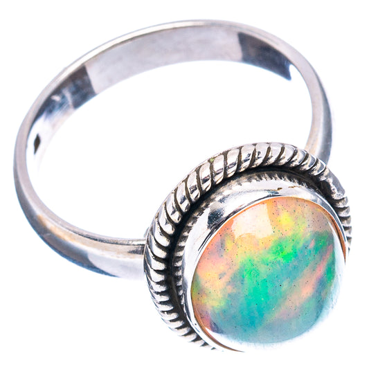 Sterling silver opal ring with oval cabochon and rope border bezel