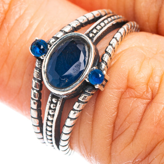 Sterling silver dainty ring with oval blue quartz center and small side blue stones