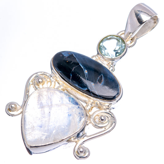Sterling silver pendant with dark oval gemstone, pearly oval stone, and round blue stone