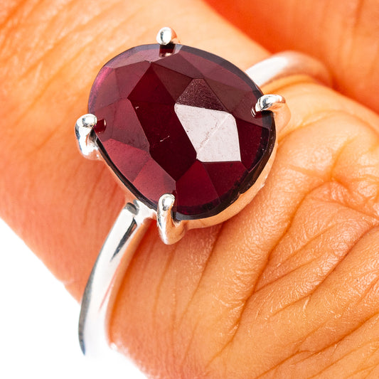 Faceted garnet ring with oval stone and four sterling silver prongs
