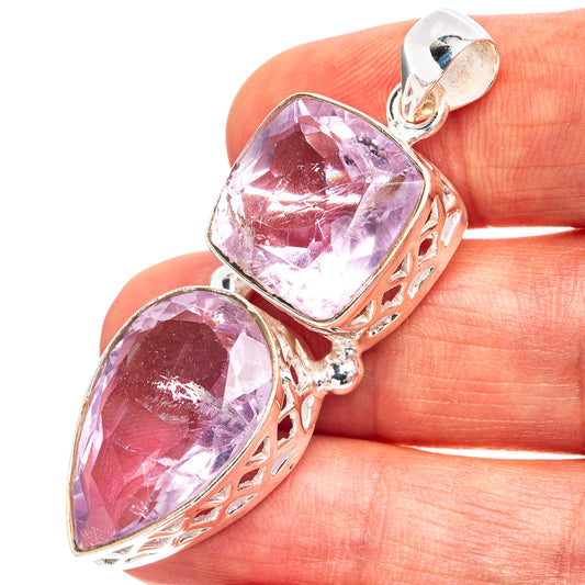 Amethyst pendant with two faceted stones in .925 sterling silver openwork bezel