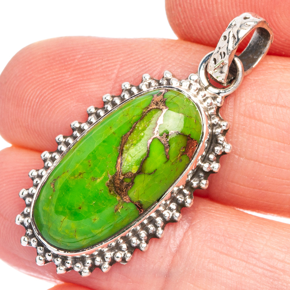 Green turquoise-style pendant with oval stone, beaded silver-tone frame on bale