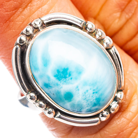 Sterling silver oval Larimar ring with bright blue marbled gemstone bezel and round prongs