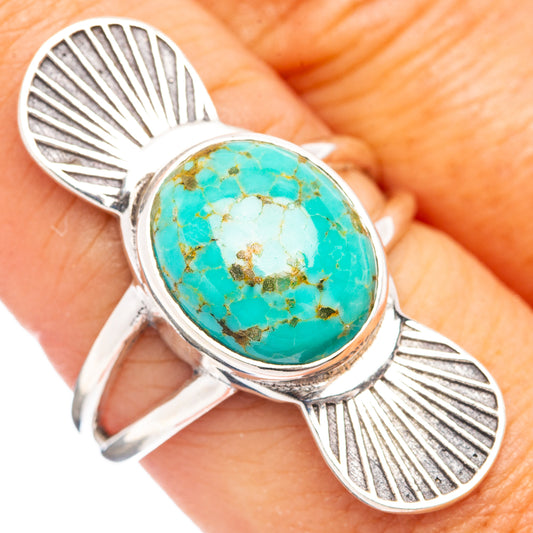 Sterling silver turquoise oval ring with leaf-and-shell side accents and turquoise cabochon