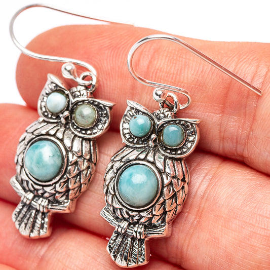 925 sterling silver owl earrings with turquoise-blue oval stones and fishhook backs.