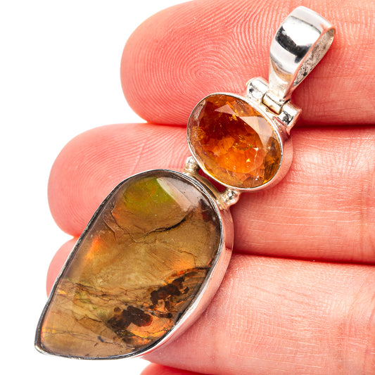 Sterling silver pendant with oval amber and mottled green-orange ammolite stones