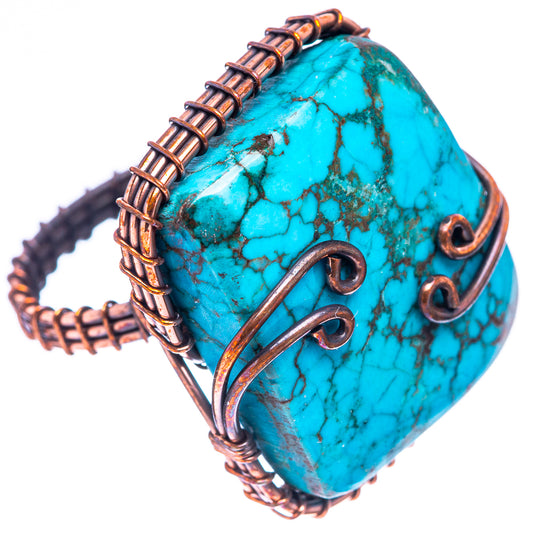 Turquoise teardrop cabochon oxidized copper wire ring with side loops and arc scroll.