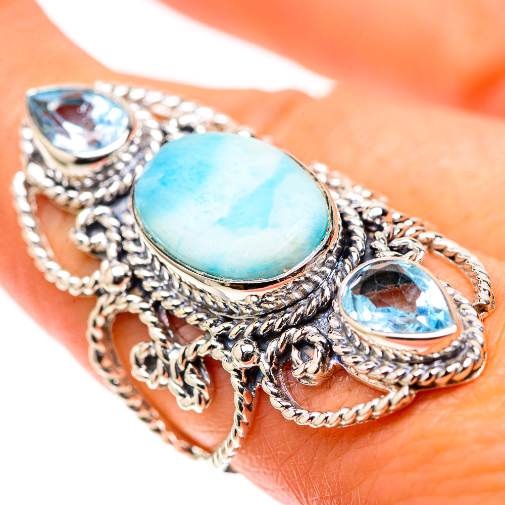 Sterling silver ring with oval turquoise center stone and blue gemstone accents