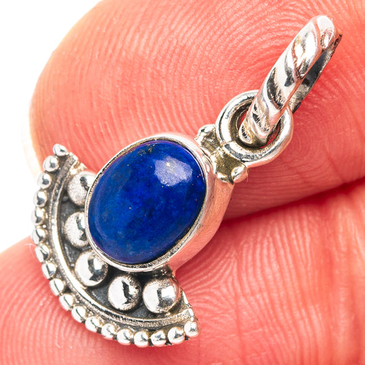 Oval lapis lazuli pendant in .925 sterling silver, ornate silver bezel and loop bail