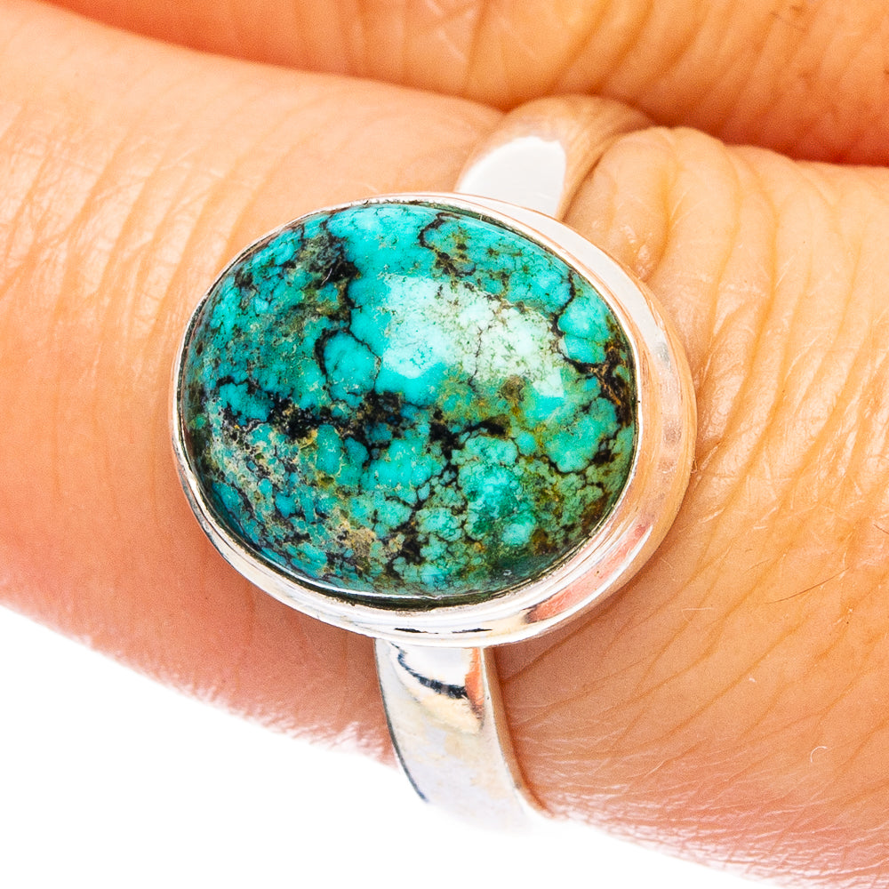 Sterling silver turquoise spiderweb cabochon ring, round face on finger
