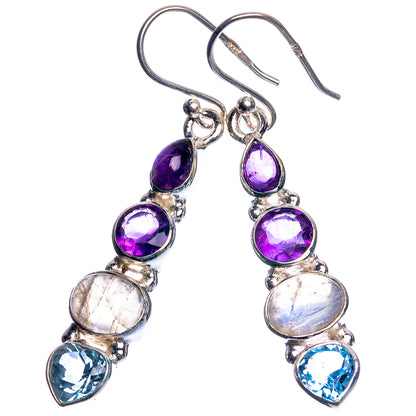 Sterling silver drop earrings with purple amethyst, moonstone, and blue topaz in teardrops