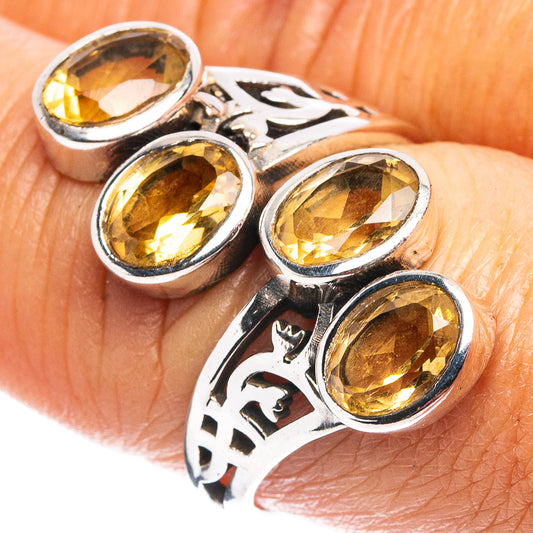 Sterling silver ring with oval faceted citrine gemstones and ornate band detail