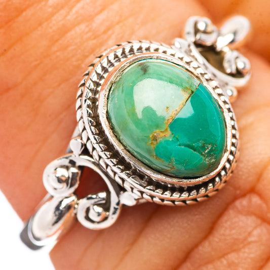 Sterling silver turquoise ring with oval green cabochon and ornate rope bezel