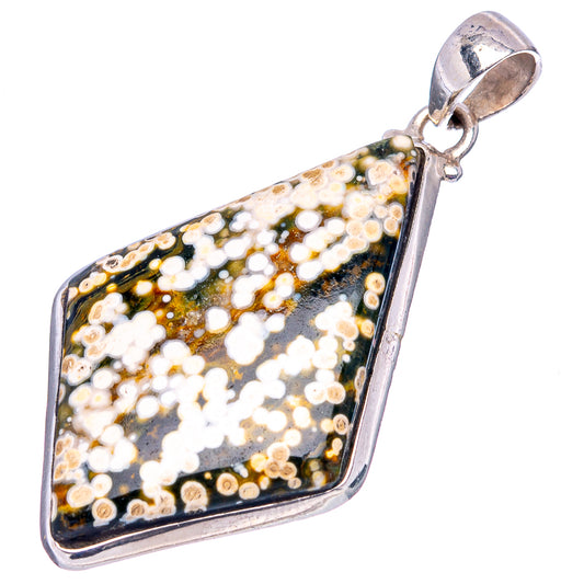 Ocean jasper pendant, teardrop-like silver-framed stone with black, white, and gold specks