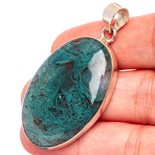 Oval moss agate pendant with teal-green veining and white areas, .925 sterling silver bail