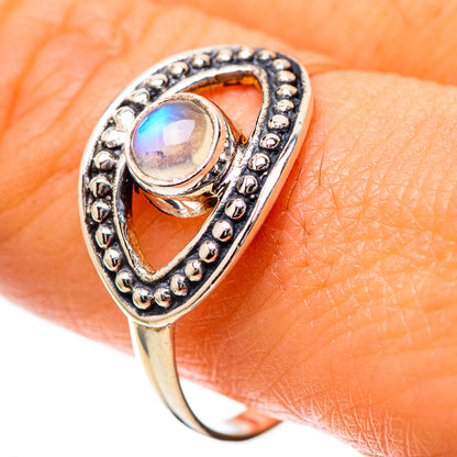 Sterling silver ring with oval rainbow moonstone cabochon and beaded border detail