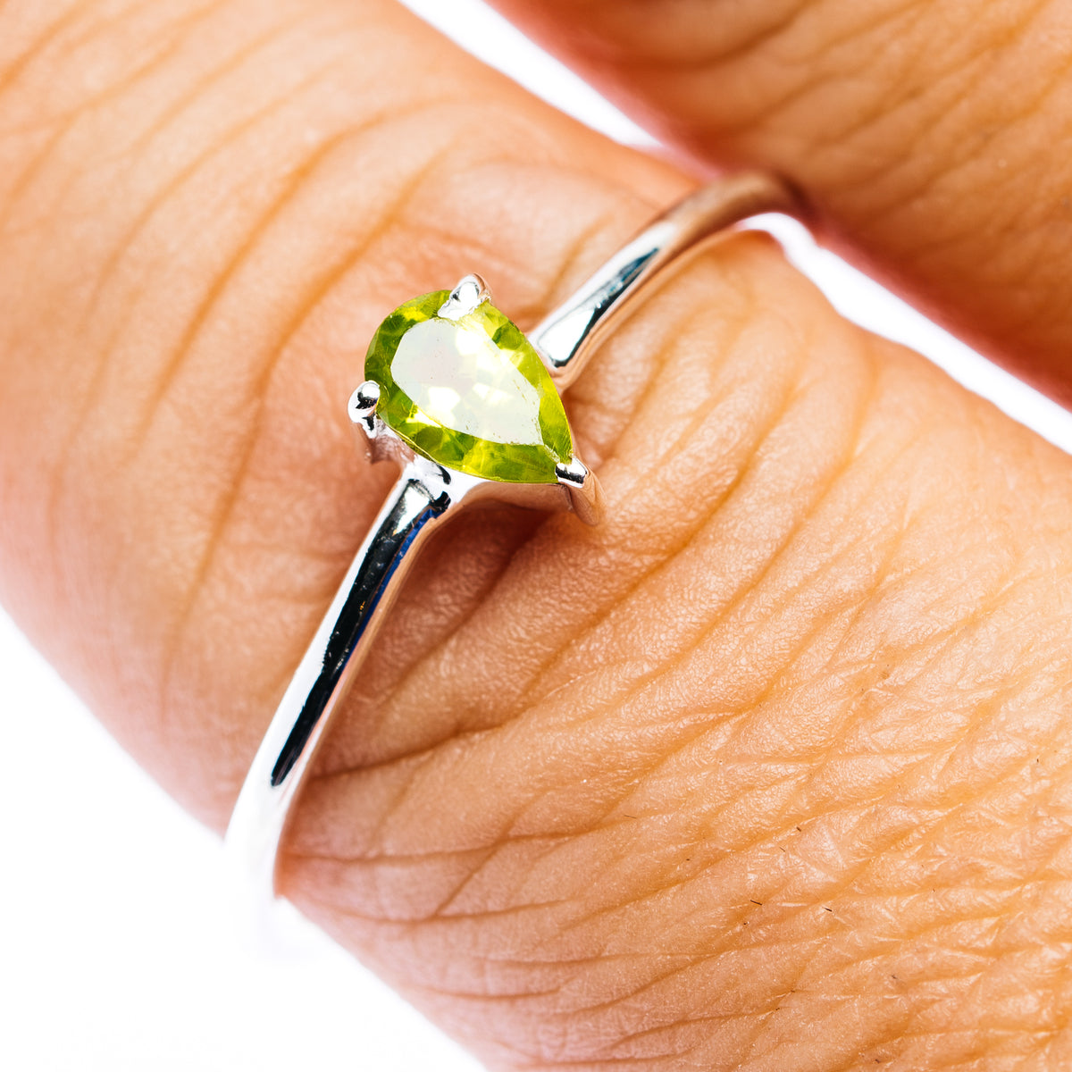 Sterling silver stackable ring with pear-shaped green peridot gemstone