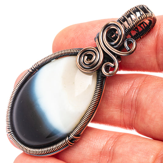 Oxidized copper wire wrap pendant with teardrop banded agate cabochon, spiral bezel