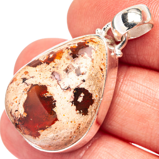 Teardrop fire opal pendant with red-orange stone matrix in .925 sterling silver bezel