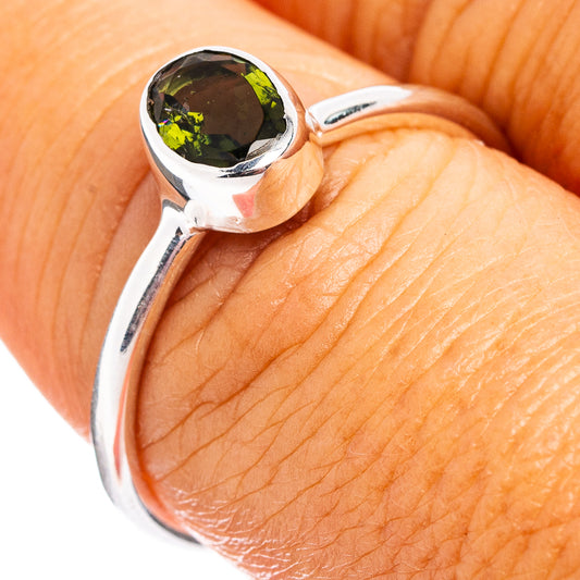 Faceted moldavite ring in .925 sterling silver with round green gemstone