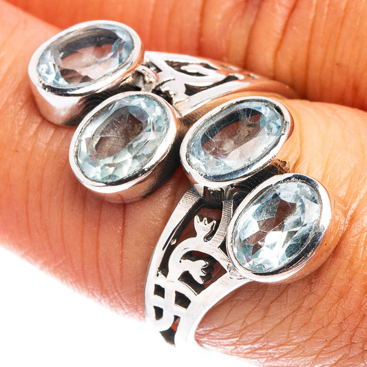 Sterling silver blue topaz ring with three oval faceted stones on a patterned band