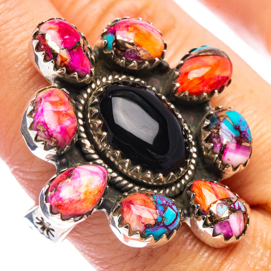 Adjustable sterling silver ring with oval black centerpiece and multicolor stone accents