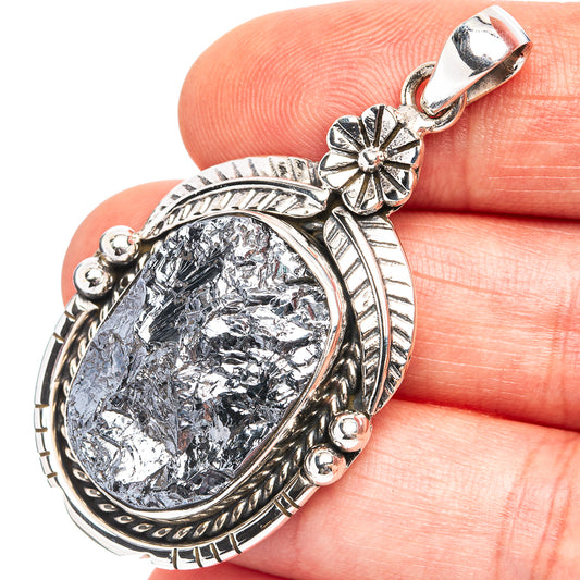 Oval shungite pendant with decorative sterling silver frame and hanging bail