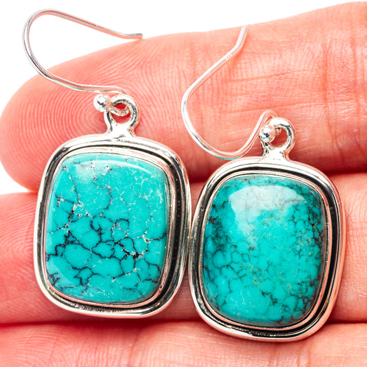 Turquoise cabochon earrings with .925 sterling silver frames and fishhook backs