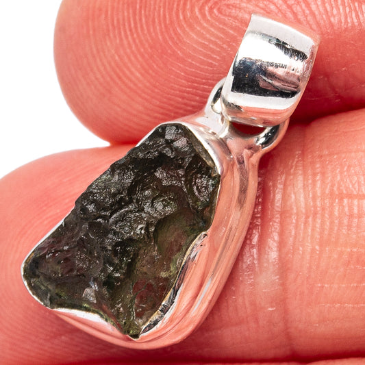 Sterling silver moldavite pendant with rough green stone and polished bail