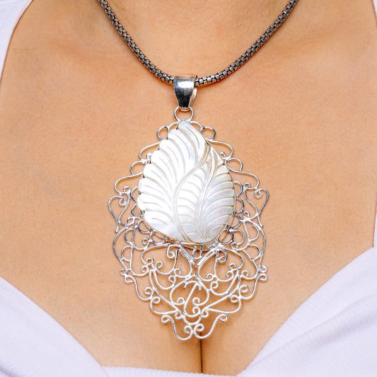.925 sterling silver mother-of-pearl leaf pendant with ornate filigree heart frame