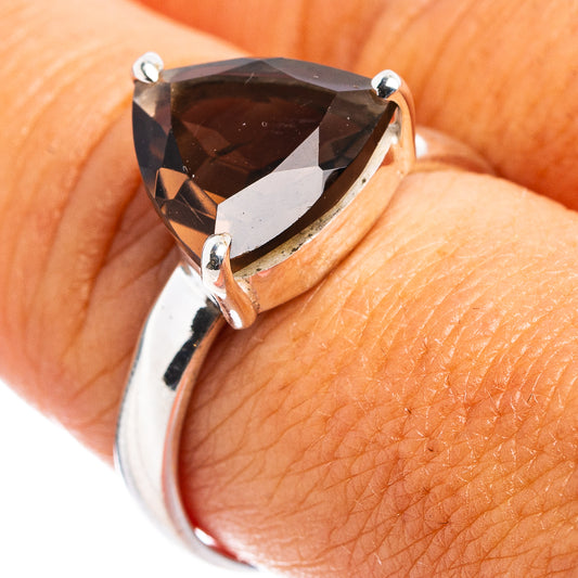 Faceted smoky quartz ring with dark gray gemstone and silver prong setting