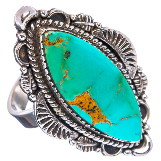 Turquoise oval cabochon ring in detailed sterling-silver frame with decorative edges