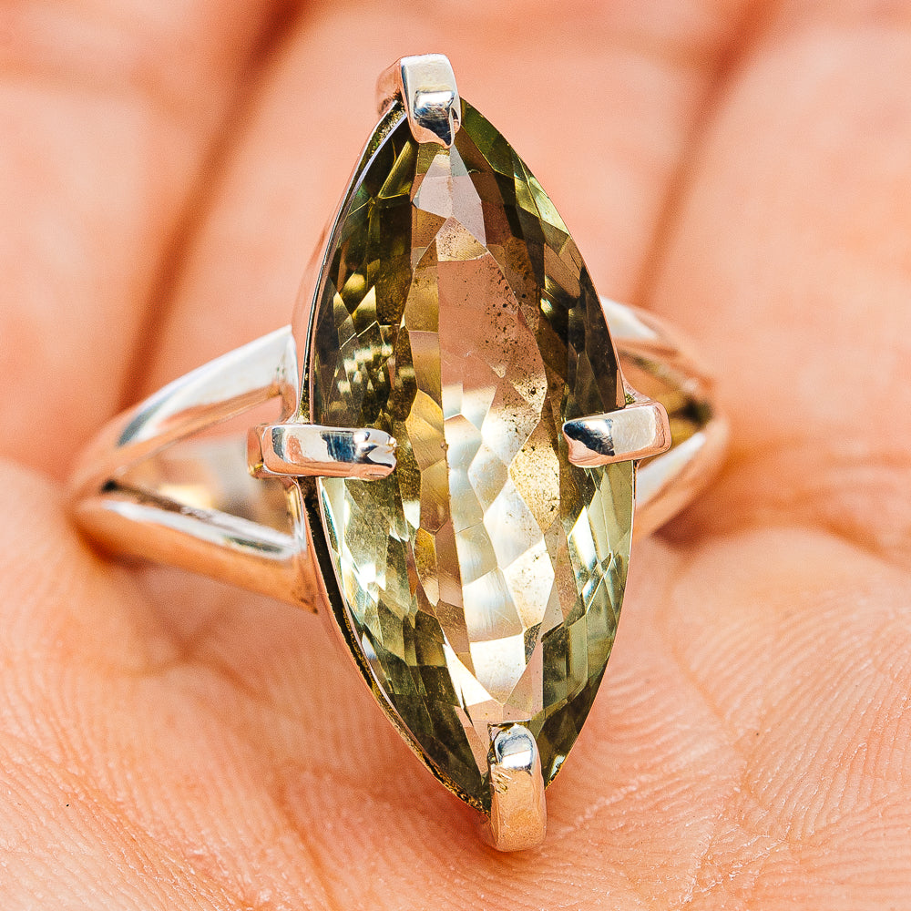 Oval green amethyst faceted gemstone ring with sterling silver prong setting, front view