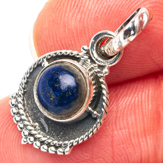 Sterling silver lapis lazuli pendant with round blue gemstone and ornate rope bezel