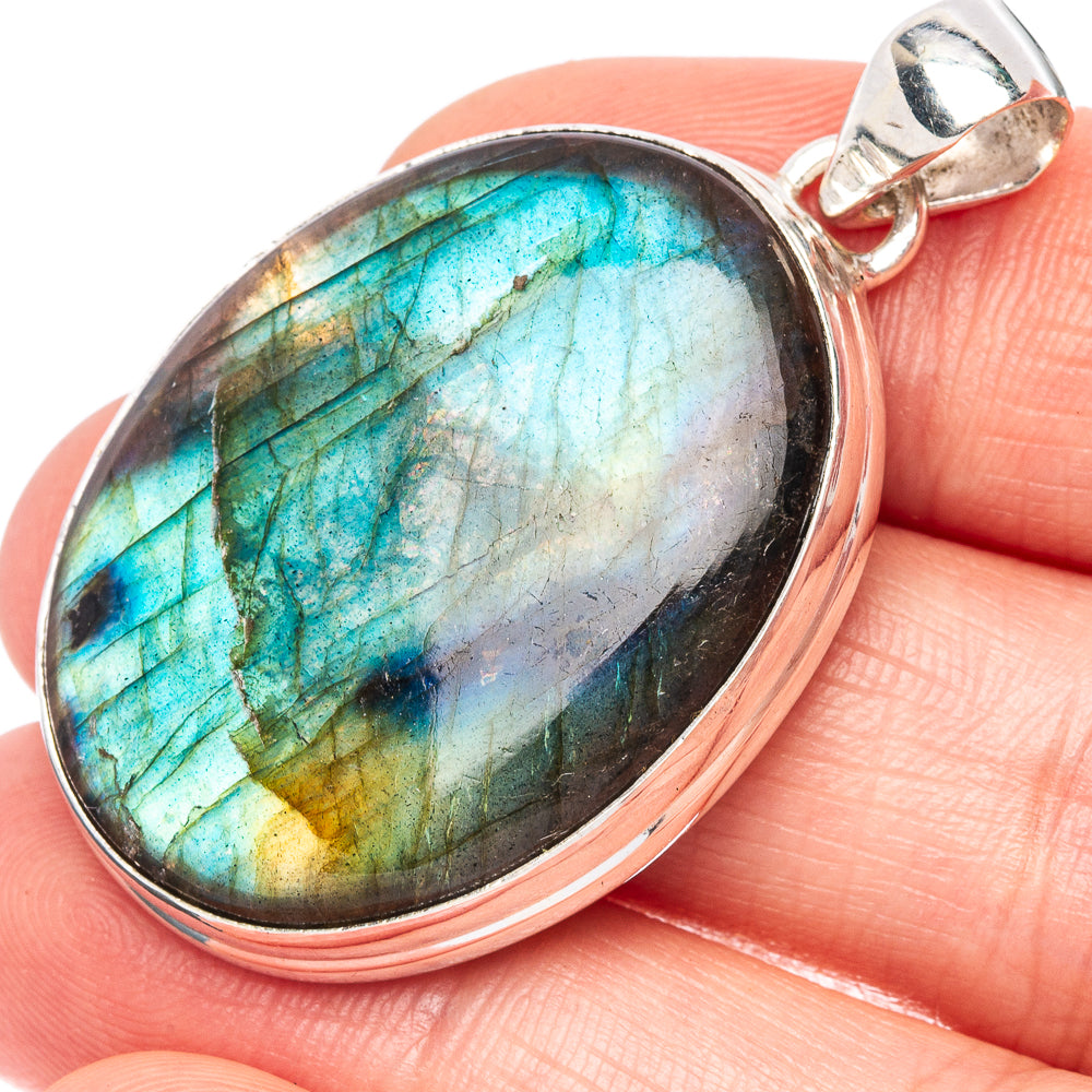 Oval labradorite pendant with teal-blue iridescence in 925 sterling silver setting